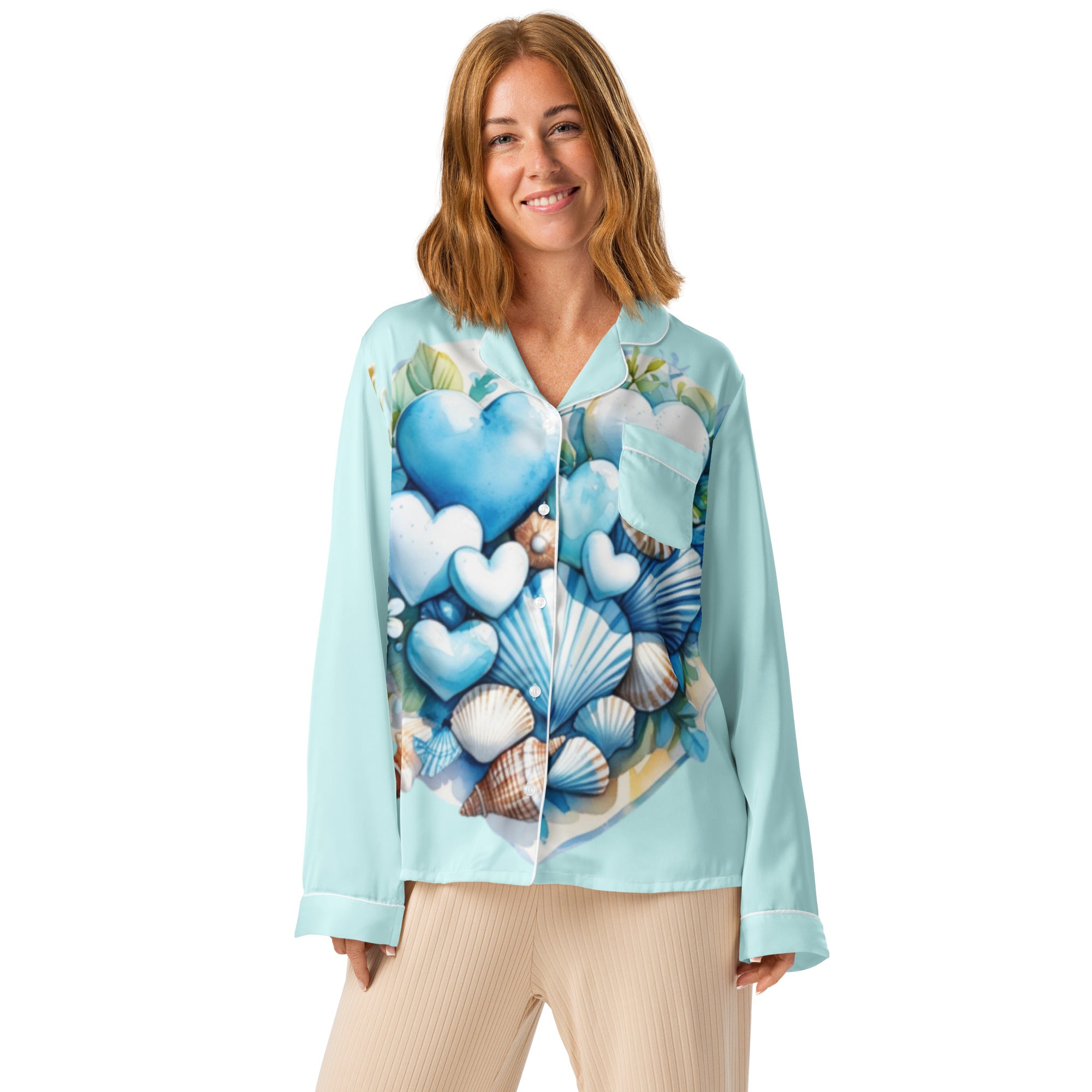 Woman in Coastal Hearts pajama top with blue hearts and shells design peaceful morning coastal lifestyle