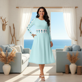 Beautiful confident plus-size woman size 6XL in light blue geometric dress looking absolutely stunning and radiant in coastal living room