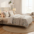 Beautiful cozy bedroom with colorful squares pattern pillows and duvet cover in pastels