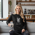 Beautiful woman in black sweatshirt with cute cat design in modern setting