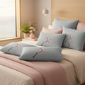 Bedroom with layered cherry blossom pillows