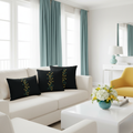 Elegant coastal living room with cream sofa, butterfly print pillows, teal curtains and yellow chair