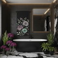 Elegant floral towel hanging on black tiled wall showing complete design, sleek black bathtub, purple blooms, sage green plants