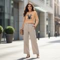 Peach beige elephant crop top high-waisted beige pants beige boots sophisticated