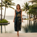 Sophisticated woman in emerald and gold jungle slip dress at luxury tropical resort